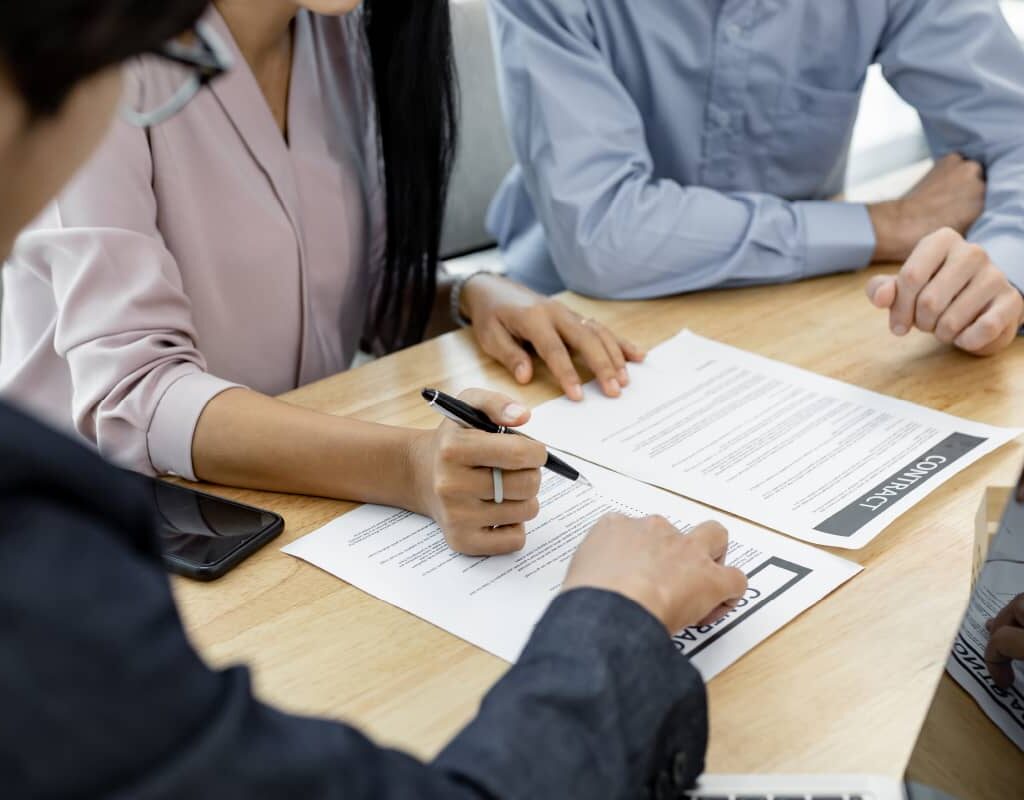 couple in transaction signing contract of house wi czdbdc7 100.jpg